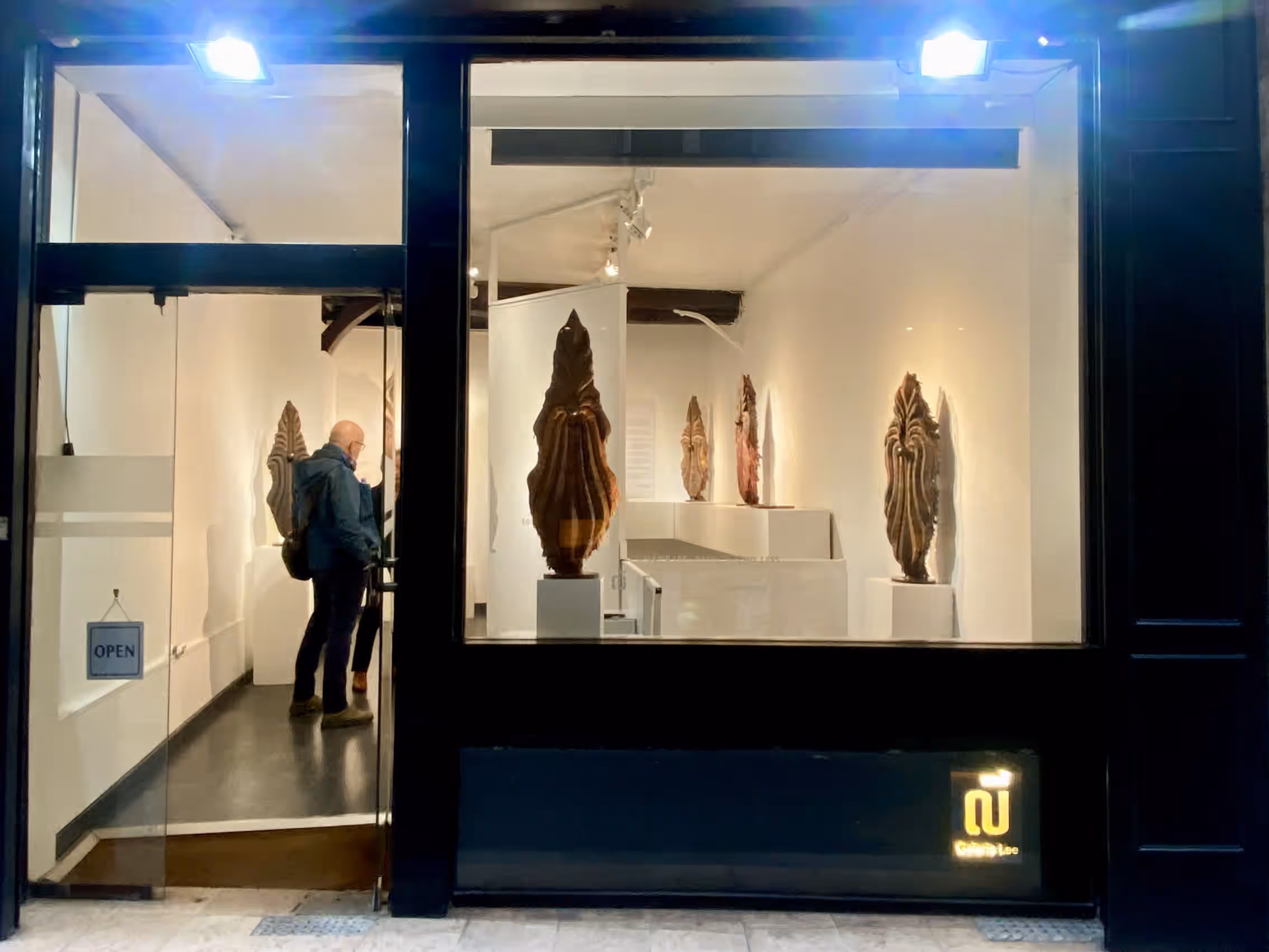 Galerie Lee window in Paris showing the sarong sculptures of Sothea Thang's The Keepers