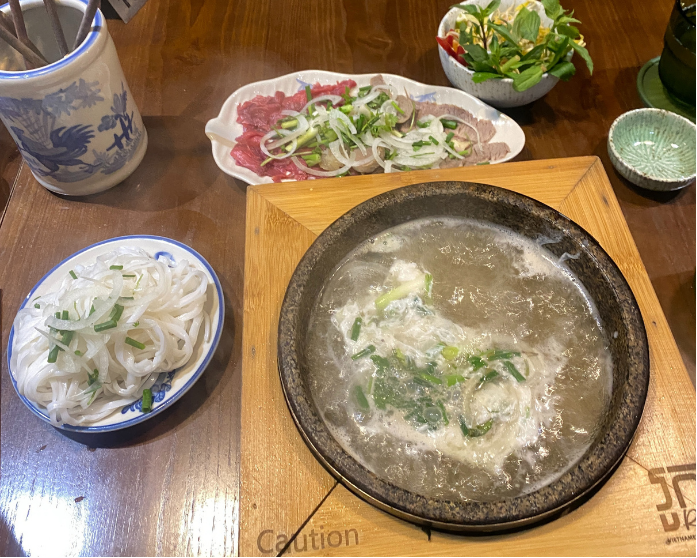 Pho in a hot stone bowl at Roka Vietnamese